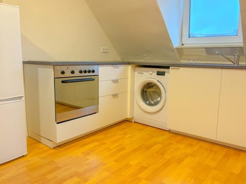 Kitchen or kitchenette, washing machine