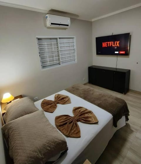 Bed, TV and multimedia, Bedroom, towels, air conditioner