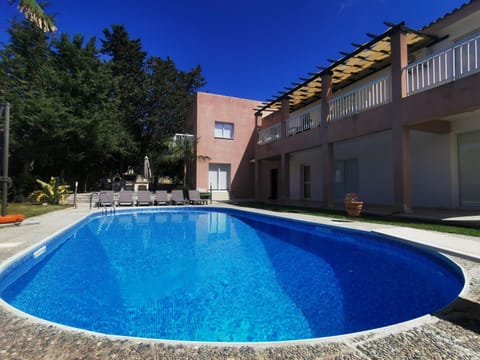 Property building, Pool view, Swimming pool, sunbed