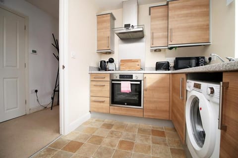 Kitchen or kitchenette, washing machine