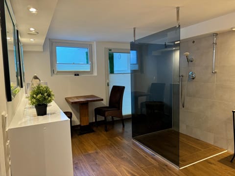 Shower, Bed, Dining area