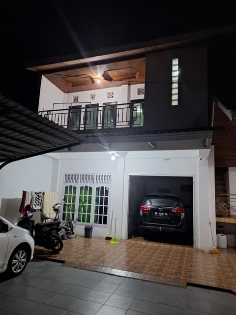 A Balcony with a Mountain View Bed and Breakfast in West Sumatra, Indonesia