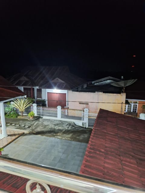 A Balcony with a Mountain View Bed and Breakfast in West Sumatra, Indonesia