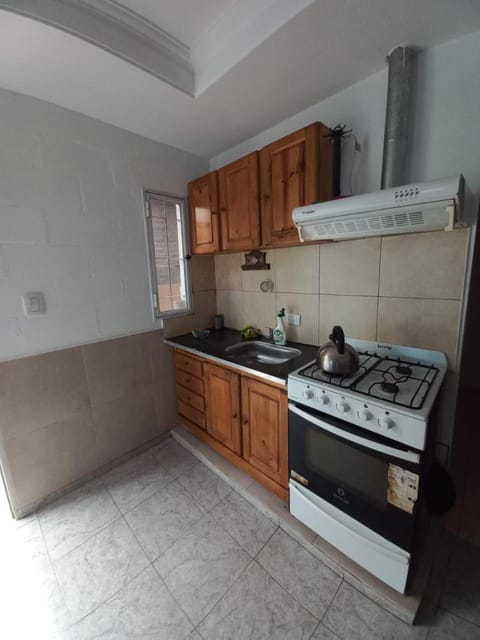 Kitchen or kitchenette, dishwasher, oven, stove