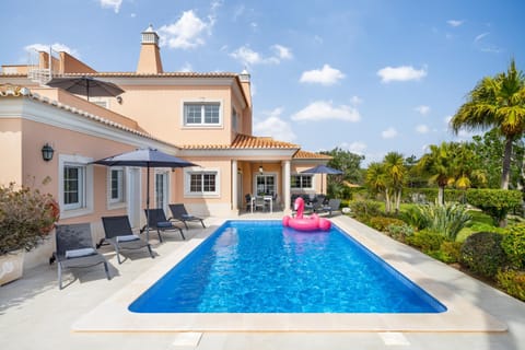 Property building, Patio, Pool view, Swimming pool, sunbed