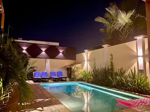 Property building, Patio, Night, Pool view, Swimming pool, sunbed