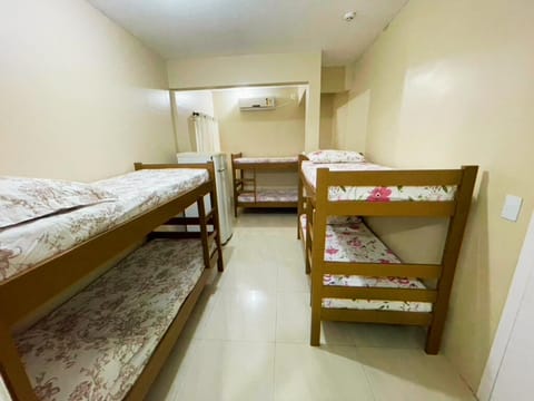 Photo of the whole room, bunk bed, air conditioner