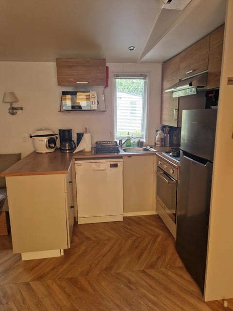 Kitchen or kitchenette, dishwasher, oven, stove, toaster