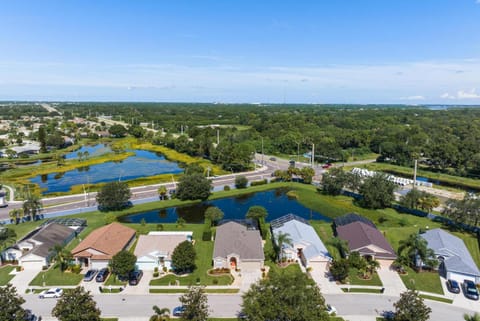 Shangri La Retreat! Lakefront private pool home with bright, tropical design! House in Bradenton