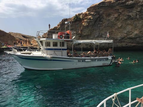 Comino Gozo Private Boat Trips Charters Docked boat in Malta