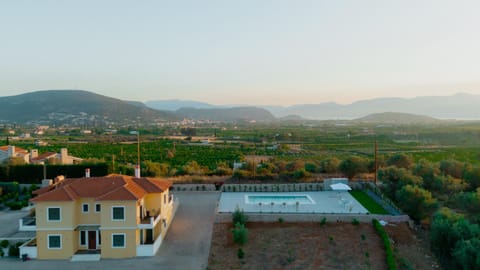 Property building, Nearby landmark, Day, Natural landscape, Bird's eye view, Mountain view, Pool view, Swimming pool, Sunset