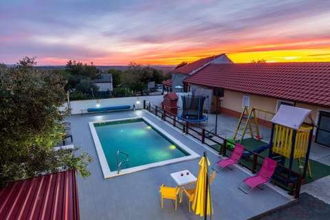 Property building, Patio, Pool view, Swimming pool, Sunset, sunbed