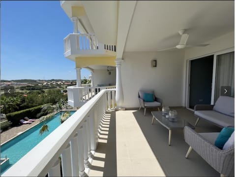 Patio, Day, View (from property/room), Balcony/Terrace, Living room, Seating area, Pool view, Sea view, Swimming pool