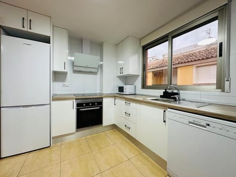 Kitchen or kitchenette, dishwasher, oven, stove, toaster