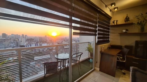 View (from property/room), Balcony/Terrace, Living room, Seating area, City view, Sunset