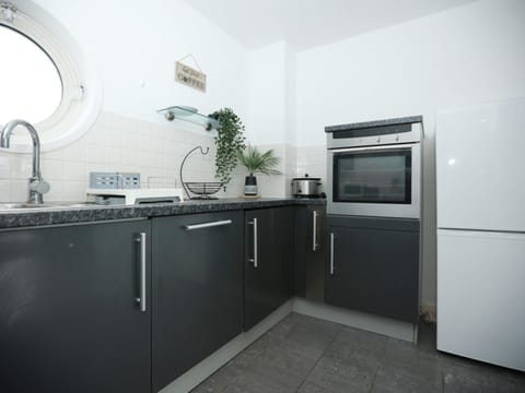 Kitchen or kitchenette, oven, stove