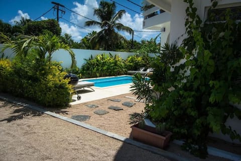 By The Beach Garden Apartment with Pool House in Grand Baie