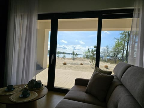 View (from property/room), Balcony/Terrace, Balcony/Terrace, Living room, Seating area, Beach, Lake view