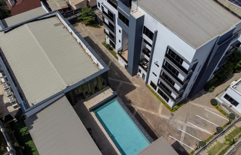 Property building, Day, Bird's eye view, Pool view, Swimming pool, Quiet street view, Parking