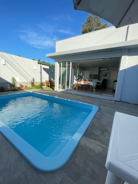 Property building, Day, Seating area, Pool view, Swimming pool