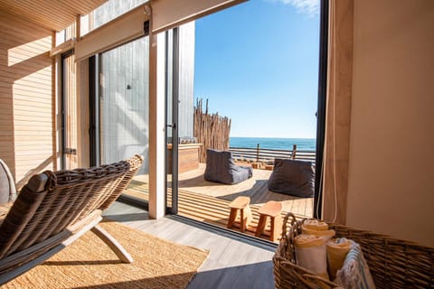 Patio, View (from property/room), Living room, Seating area, Beach, Sea view