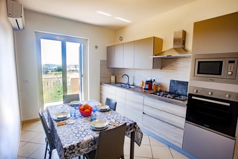 Photo of the whole room, Dining area, stove, kitchen