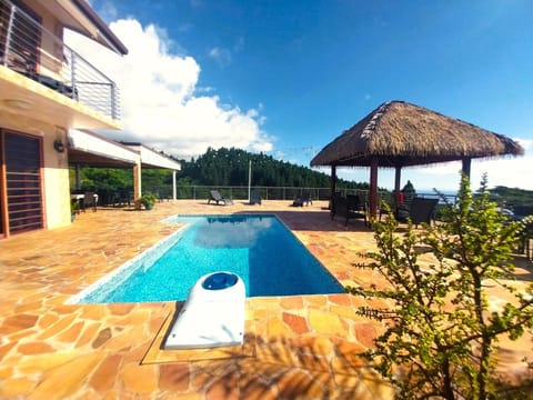 Property building, Patio, Natural landscape, Swimming pool, sunbed