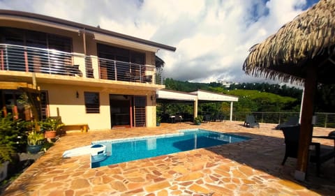 Property building, Patio, Pool view, Swimming pool, sunbed