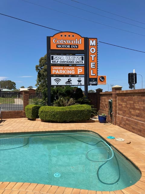 Property building, Property logo or sign, Swimming pool