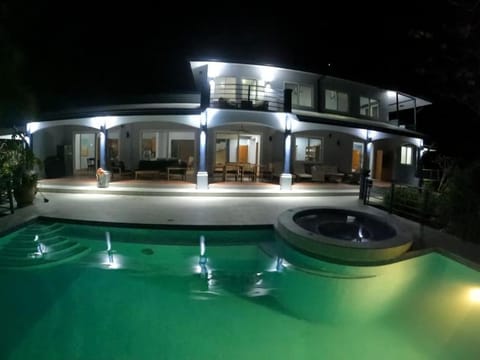 Property building, Patio, Night, Pool view, Swimming pool