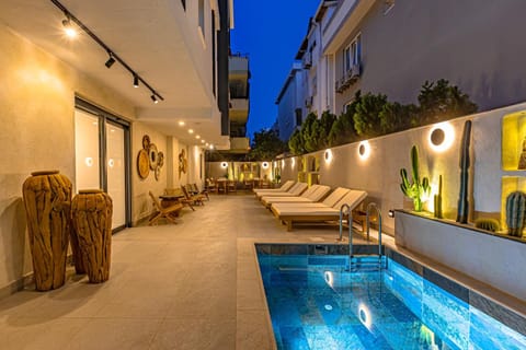 Property building, Patio, Night, Natural landscape, Pool view, Swimming pool, sunbed