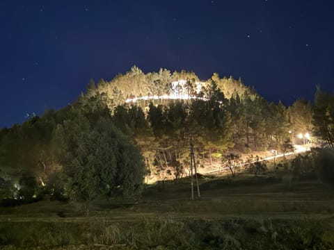 Property building, Nearby landmark, Facade/entrance, Night, Natural landscape, Landmark view, Mountain view