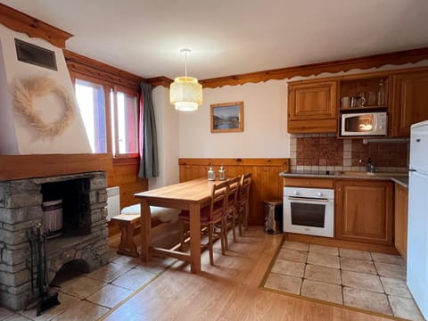 Dining area, fireplace, kitchen