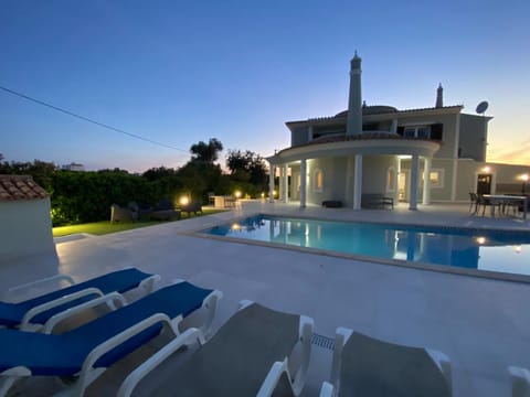 Property building, Patio, Natural landscape, Pool view, Swimming pool, sunbed