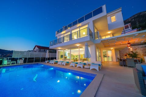 Property building, Patio, Night, Pool view, Swimming pool, sunbed