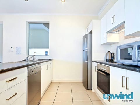 Kitchen or kitchenette, dishwasher, oven, stove