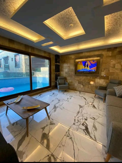 TV and multimedia, Living room, Seating area, Pool view, Swimming pool