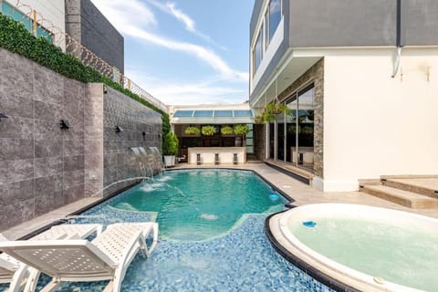 Property building, Day, Pool view, Swimming pool, sunbed