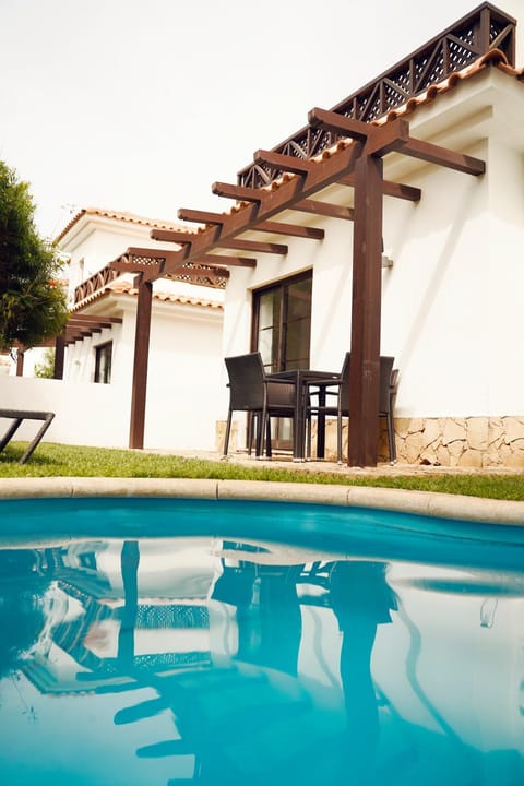 Property building, Patio, Pool view, Swimming pool, sunbed