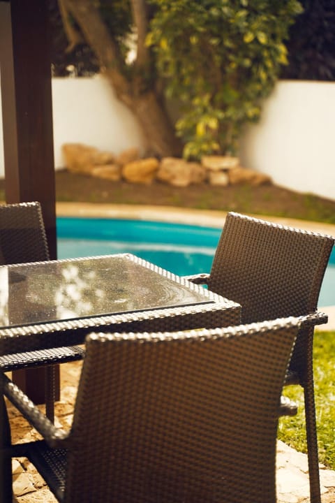 Seating area, Dining area, Pool view, Swimming pool