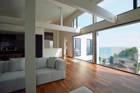 Natural landscape, View (from property/room), Living room, Seating area, Sea view