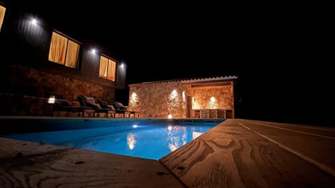 Patio, Night, Pool view, Swimming pool, sunbed