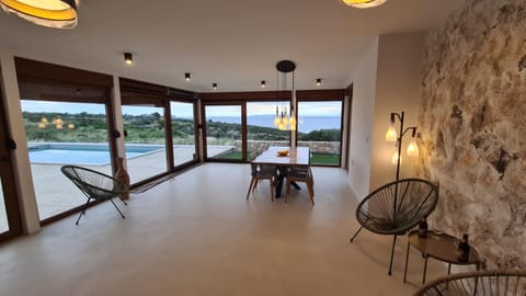 Living room, Dining area, Pool view