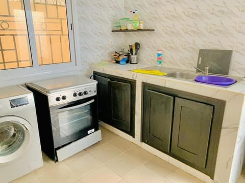 Kitchen or kitchenette, oven, stove, washing machine