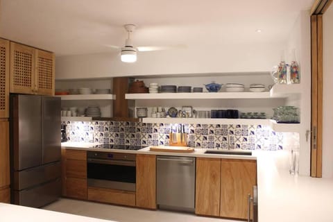 Kitchen or kitchenette, dishwasher, oven, stove