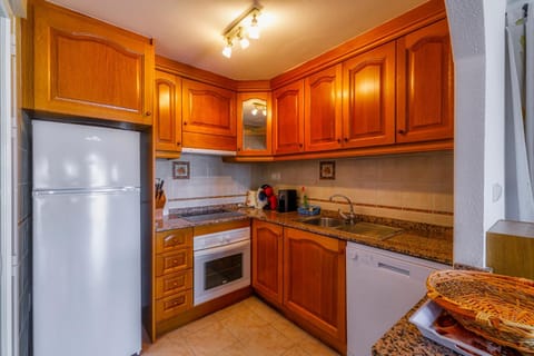 Kitchen or kitchenette, dishwasher, oven, stove, toaster