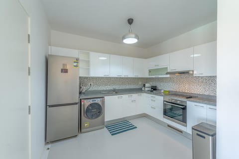 Kitchen or kitchenette, dishwasher, minibar, oven, stove, washing machine, dryer