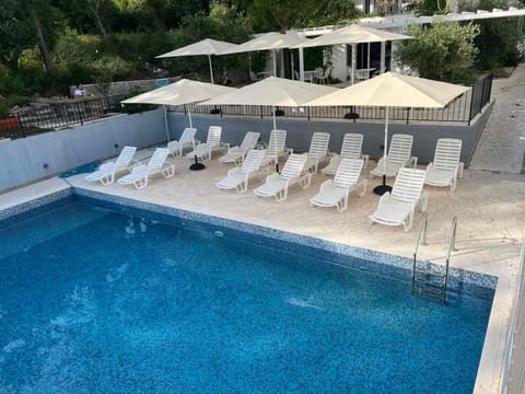 Patio, Day, Pool view, Swimming pool, sunbed