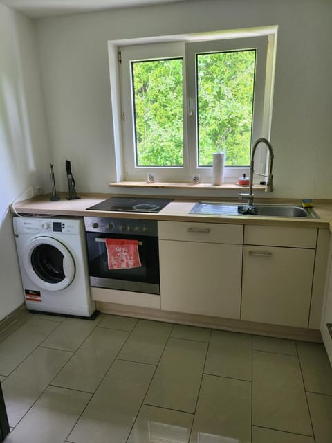 Kitchen or kitchenette, dishwasher, stove, washing machine