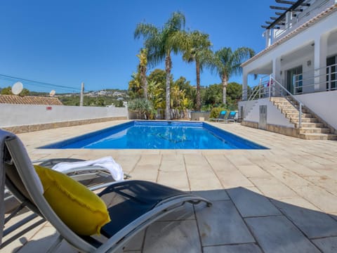 Property building, Living room, Swimming pool